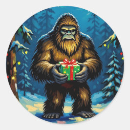 Grappige Bigfoot die een kerstcadeau vasthoudt Ronde Sticker