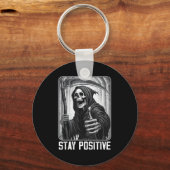 Grappige blijf positief grim reaper skelet schedel sleutelhanger (Voorkant)