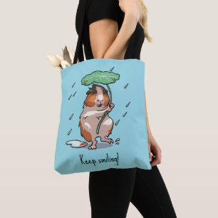 Grappige cavia houden glimlachende regen dansende tote bag