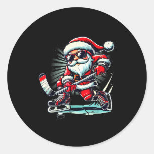 Grappige Kerstman die ijshockey speelt Liefhebbers Ronde Sticker