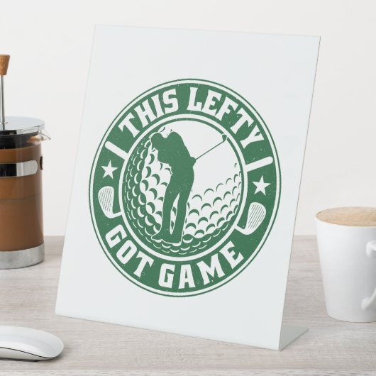 Grappige linkshandige golfspeler reclamebord met voetstuk (Insitu)