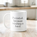 Grappige Pickleball Typografie Eenvoudige minimali Koffiemok<br><div class="desc">Geniet van uw koffie met een vleugje humor met de Funny Pickleball Typography Simple Minimalist Coffee Mok. Deze stijlvolle mok heeft een strak, minimalistisch design met geestige pickleball gezegden die een glimlach op je gezicht brengen. Gemaakt van hoogwaardig keramiek, het is perfect voor je ochtendbrouwsel of middagthee. Het comfortabele handvat...</div>