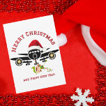 Grappige Schattigee Elf springen op vliegtuig, ker Feestdagenkaart<br><div class="desc">Grappige Schattigee Elf springen op het vliegtuig, Kerstmis Foto Ornament. Het ontwerp is voorzien van een minimalistische illustratie van een groot vliegtuig bekroond met een rode kerstmuts. Een schattige Elf springt uit het vliegtuig en hangt aan een reeks kerstverlichting. De achterkant van de kaart heeft een oprechte boodschap aan uw...</div>