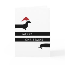 Grappige Tekkel met het pet van de Kerstman