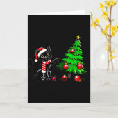 Grappige zwarte kat duwt kerstboom om Kattenwh Kaart (Gele Bloem)