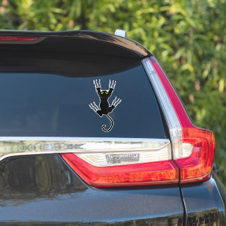 Grappige zwarte kat glijdt langs een raam sticker