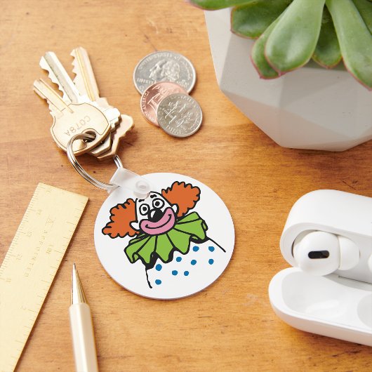 Gratis Clown Karakter met Oranje Haar Sleutelhanger