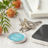 Gratis Hugs Button Sleutelhanger (Zijkant)