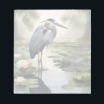 Great Blue Heron Notitieblok<br><div class="desc">Dit afbeelding is een schilderachtige weergave van een Great Blue Heron wading in een vijver vol waterlelies omringd door wilgenbomen. Great Blue Heron is een door AI gegenereerd afbeelding van een van de vele soorten watervogels.</div>