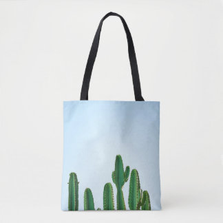 Green cactus plant in white background tote bag