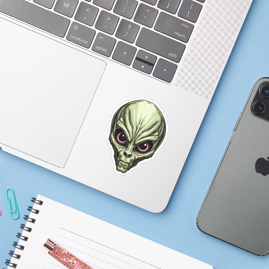 Green Space Alien Gezicht Griezelige Cartoon Alien Sticker (Laptop met iPhone)