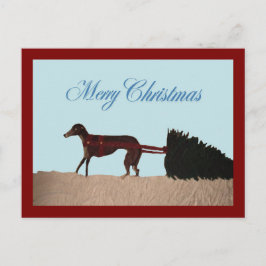 Greyhound trekt een kerstboom door de sneeuw briefkaart