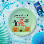 Griezelige groene handen die opkomen met pompoenen papieren bordje (Feest)