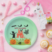 Griezelige groene handen die opkomen met pompoenen papieren bordje (Feest)