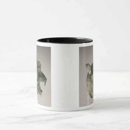 Griffiekkop, fragment van een bevestigingselement  mok (Midden)