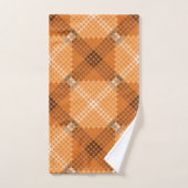 Grijs tot bruine cirkels boven sinaasappel, waarbi bad handdoek (Handdoek)