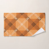 Grijs tot bruine cirkels boven sinaasappel, waarbi bad handdoek (Handdoek)