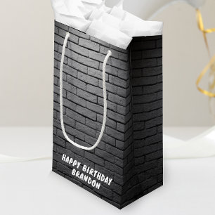 Grijze bakstenen muur verjaardagsfeestje klein cadeauzakje