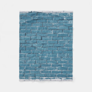 Grijze betonstenen verven in blauw fleece deken