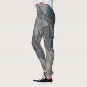 Grijze driehoeksnede met ruwe, donkerblauwe stukke leggings (Links)