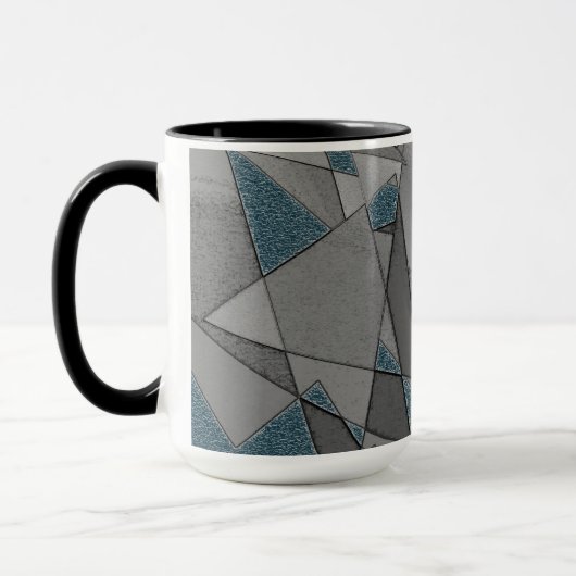 Grijze driehoeksnede met ruwe, donkerblauwe stukke mok (Links)