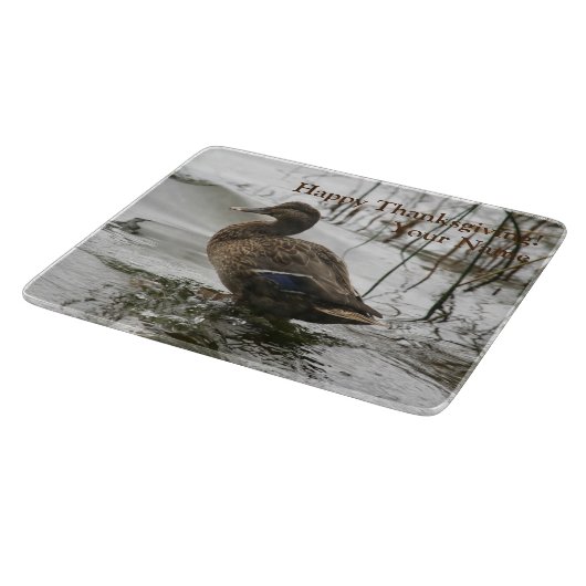 Grijze eend op donker het meer snijplank (Hoek)