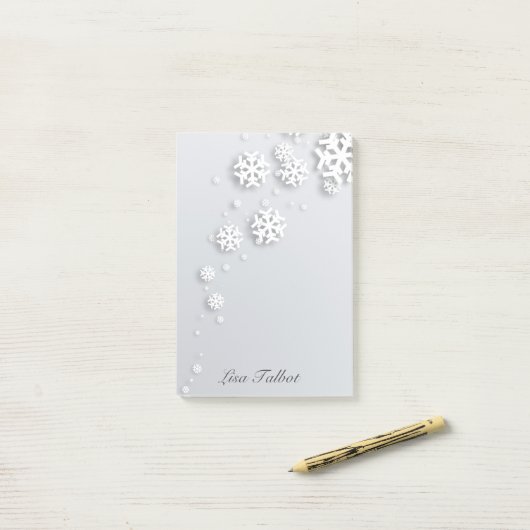 Grijze en witte sneeuwvlokken post-it® notes (Op bureau)