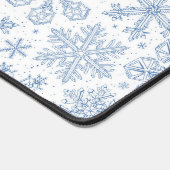 Grijze sneeuwvlokken op gebroken wit bureaumat (Hoek)