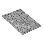 Grijze stenen muur, abstracte achtergrond. notitieboek (Rechterzijde)