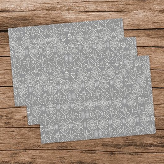 Grijze vezelige textiel octopus zaden met patronen inpakpapier vel