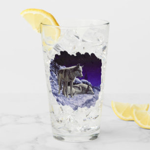 Grijze wolven in wintersneeuw bij nacht glas