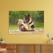 Grijze wolvenwelpen worstelen canvas afdruk (Insitu (Woonkamer))