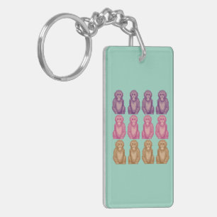 Grillige pixelstijl kleurrijke apen sleutelhanger