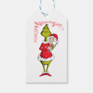 Grinch houdt Cindy Lou Who vast Cadeaulabel