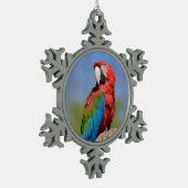 Groen gevleugelde ara neergestreken tin sneeuwvlok ornament (Links)