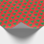 Groen kerstboompatroon op rode achtergrond cadeaupapier (Hoek)