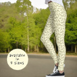 Groen lederen patroon op pastel gele achtergrond leggings<br><div class="desc">Dit de stijlontwerp van de natuur kenmerkt een groen tak en bladpatroon op een pastelgele achtergrond.</div>