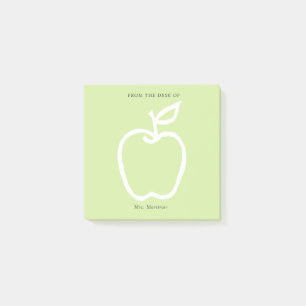Groene appel met leraar van het bureau van 3 x 3 post-it® notes