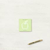 Groene appel met leraar van het bureau van 3 x 3 post-it® notes (Op bureau)