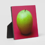 Groene appel op rode achtergrond fotoplaat (Voorkant)