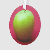 Groene appel op rode achtergrond ornament (voorkant)