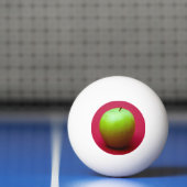 Groene appel op rode achtergrond pingpongbal (Net)