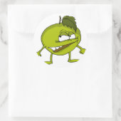 Groene appeltekenfilm met een boosaardige glimlach ronde sticker (Tas)