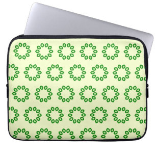 Groene bladeren in een cirkel op geel laptop sleeve