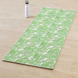 Groene bladeren op wit yogamat
