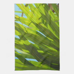 Groene bladeren, zonlicht en blauwe lucht theedoek
