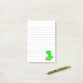 Groene Dinosaur houdt van ingesloten voetbal Post-it® Notes (Op bureau)