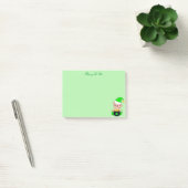 Groene elf en gouden munten op groen post-it® notes (Kantoor)