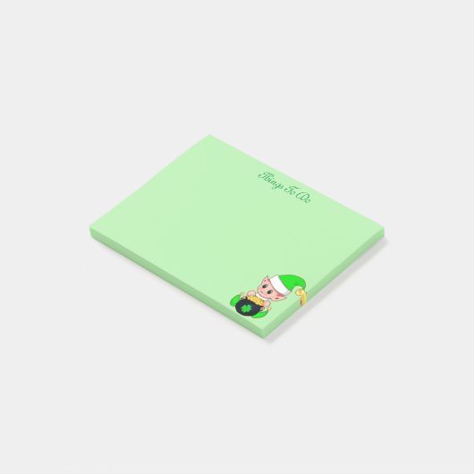 Groene elf en gouden munten op groen post-it® notes (Schuin)