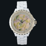Groene en gele bladeren op zonnescherm horloge<br><div class="desc">Het paarse en goudkleurige zonsondergang is het perfecte contrast met de gele en groene bladeren die de focus van dit stuk vormen door Megan Meagher. Je kunt bijna horen hoe de wind zingt terwijl hij zachtjes met de bladeren omspringt.</div>